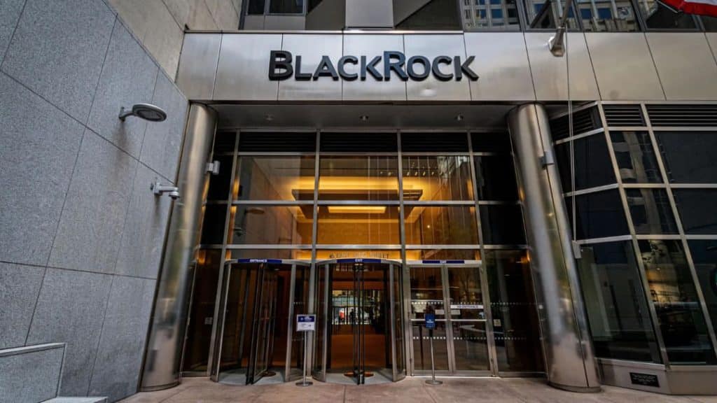 black rock building bit - Digital Wager Wire BlackRock office building entrance with glass revolving doors and a modern metal facade, signage reading 'BlackRock' above.