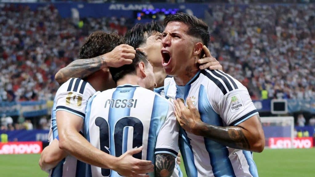 messi and team celebrate - Digital Wager Wire Argentina players celebrate a goal, Messi wearing number 10 is at the center being hugged by teammates in a stadium